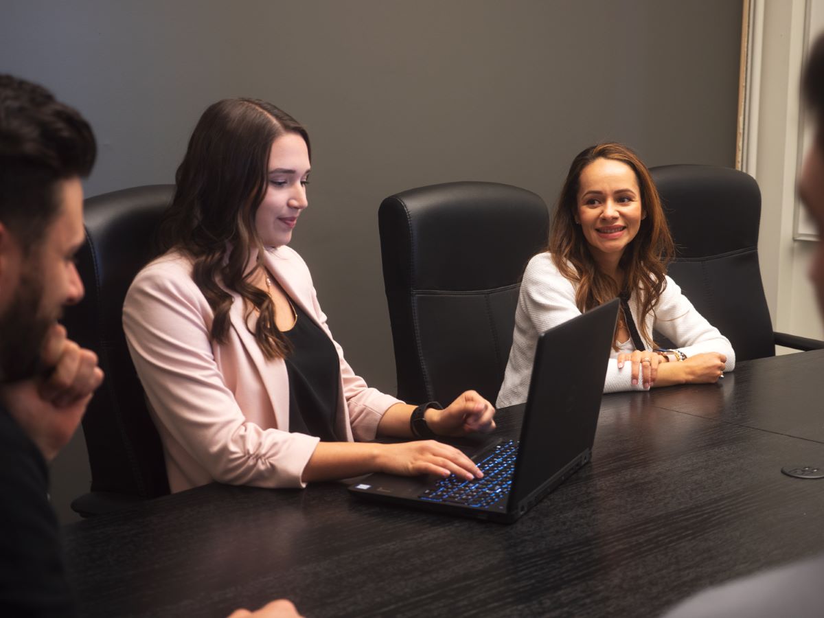 three members working at board room