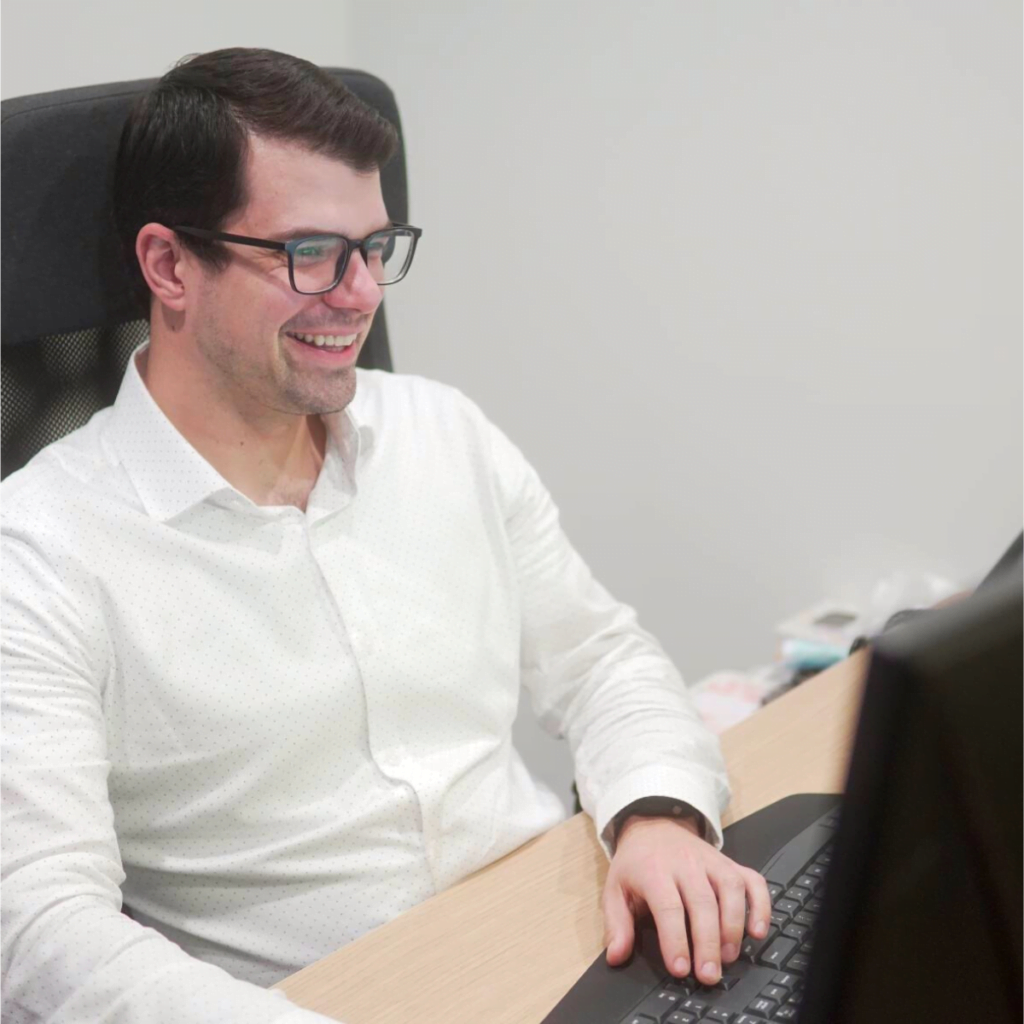 man sitting at desk working