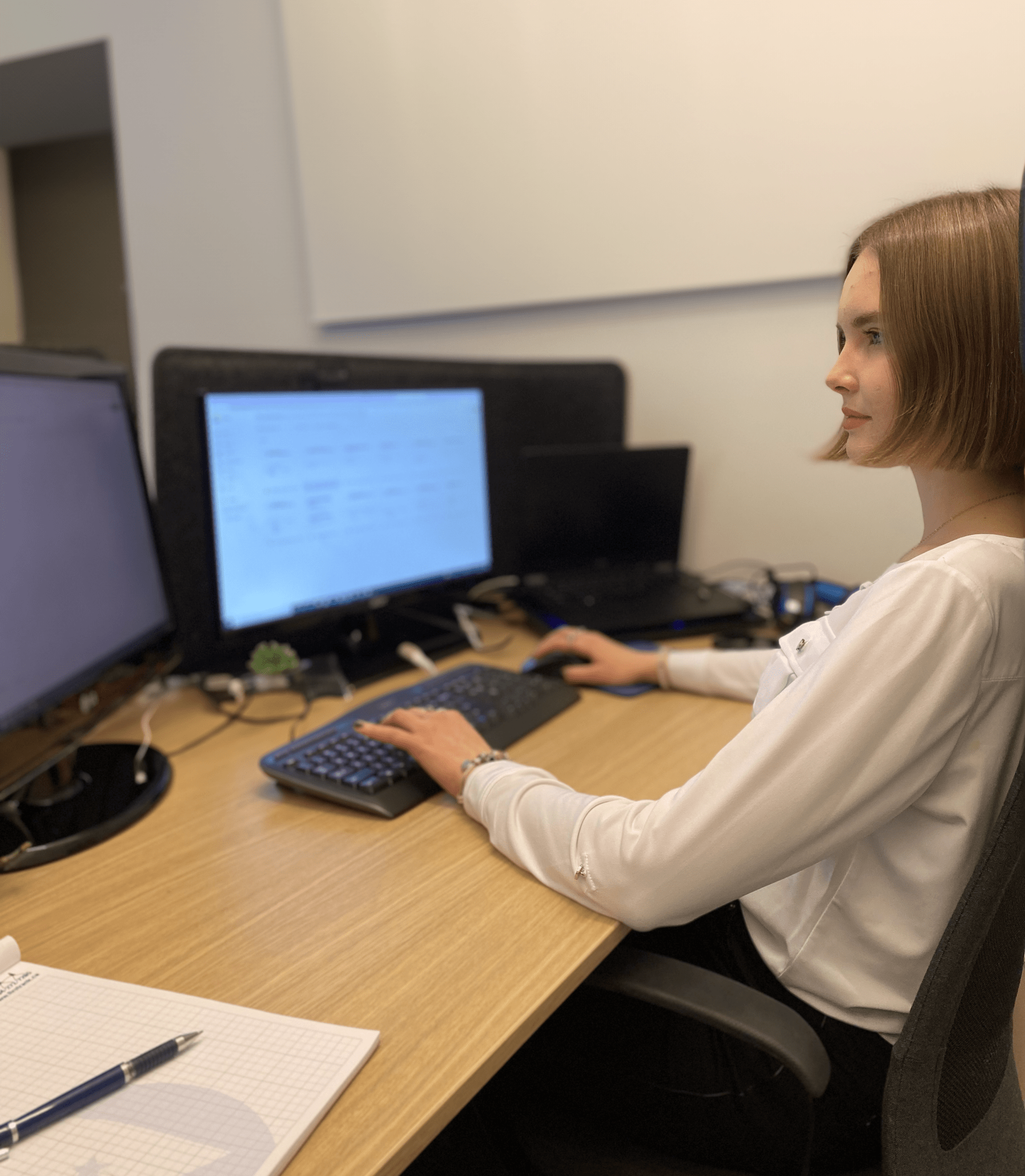 women sitting at computer